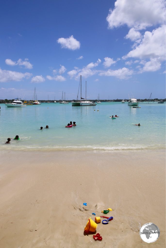 The protected waters of Grand Baie beach are popular with families.