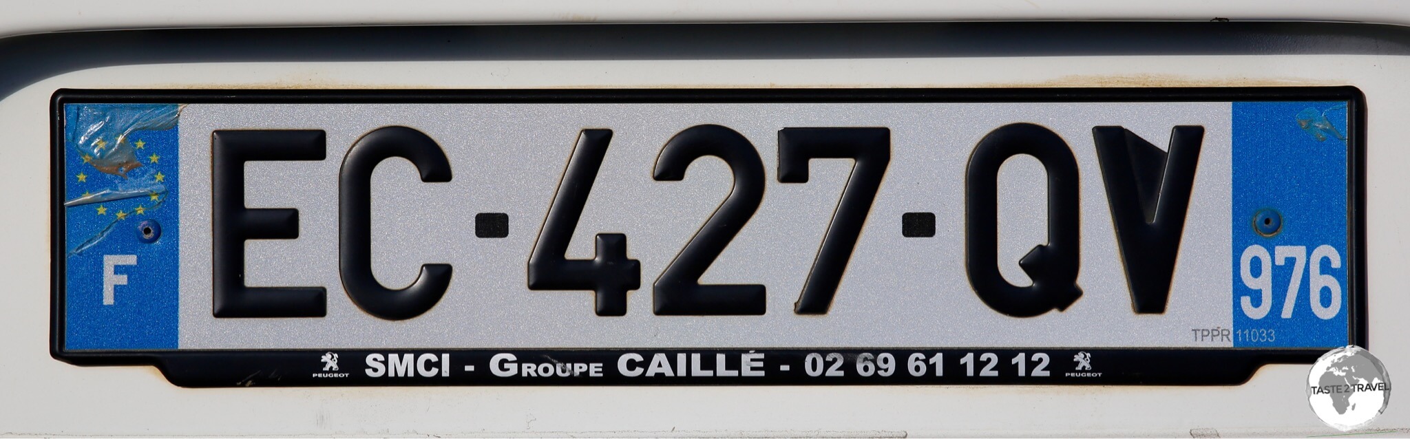 Mayotte Travel Guide: The license plate of my rental car bearing the Mayotte department number of 976.