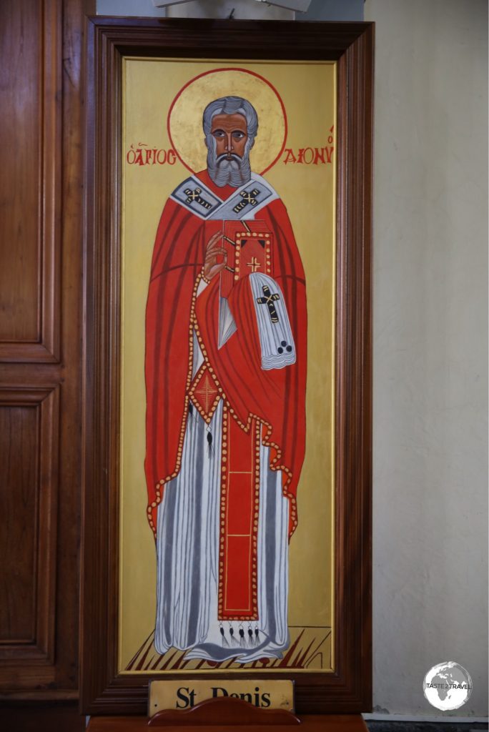 An image of the patron saint of the city - Saint Denis - on display inside the cathedral.