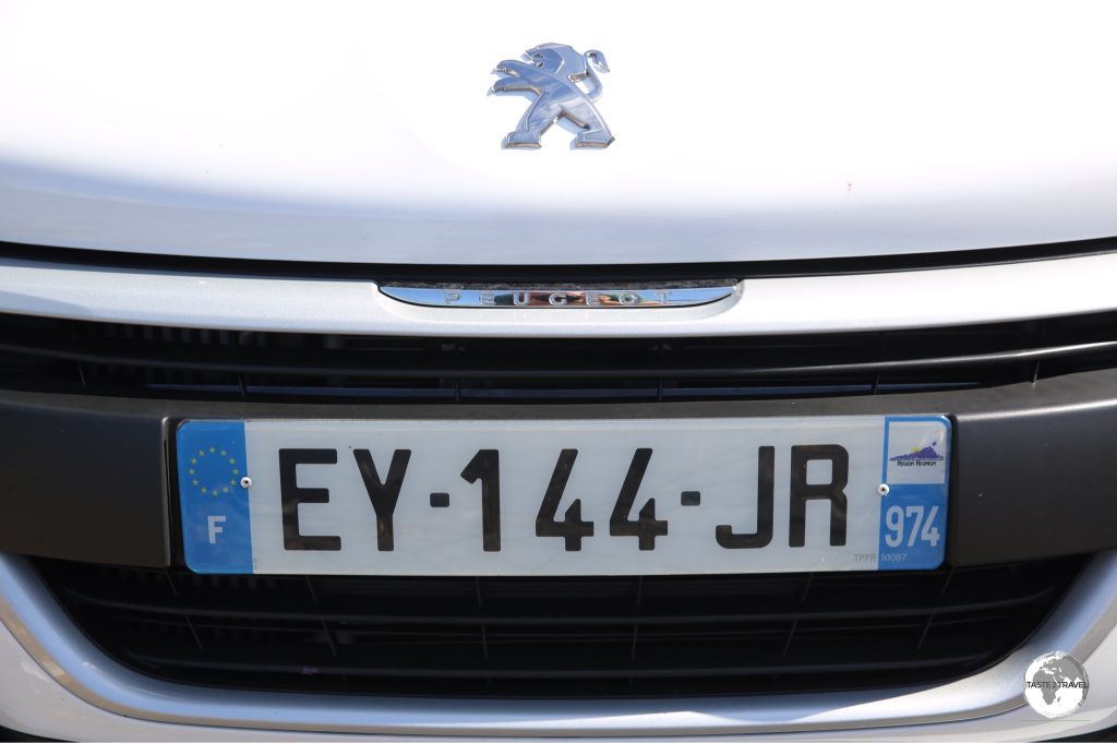 The license plate on my rental car with the ‘974’ French department number.