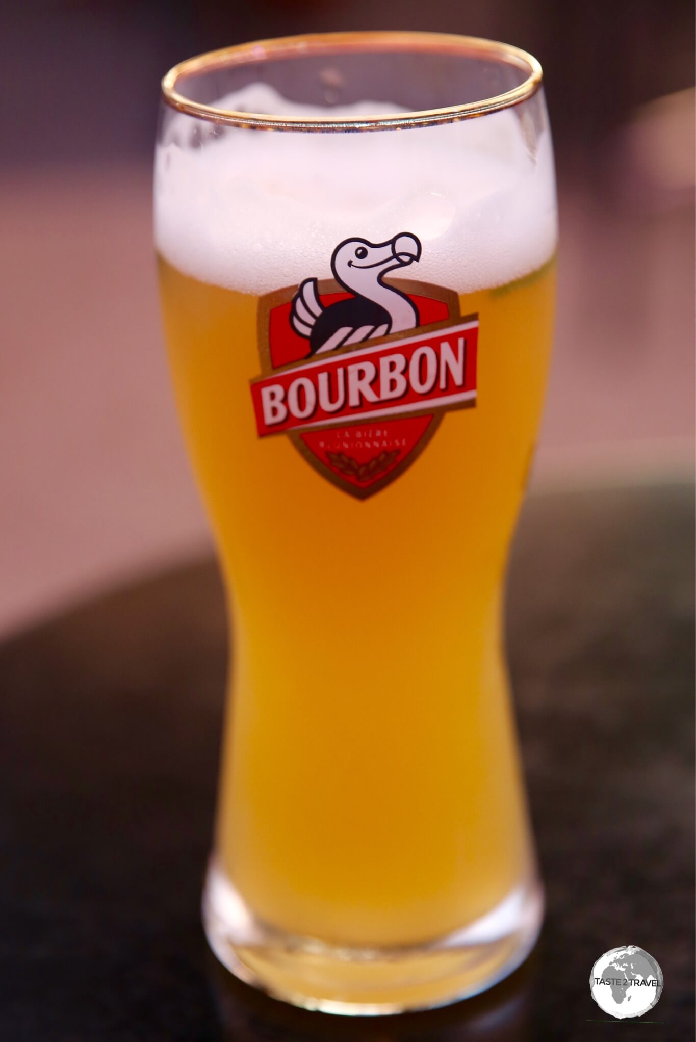 Enjoying a glass of the Bourbon Blanche at La Palmeraie in St. Gilles.