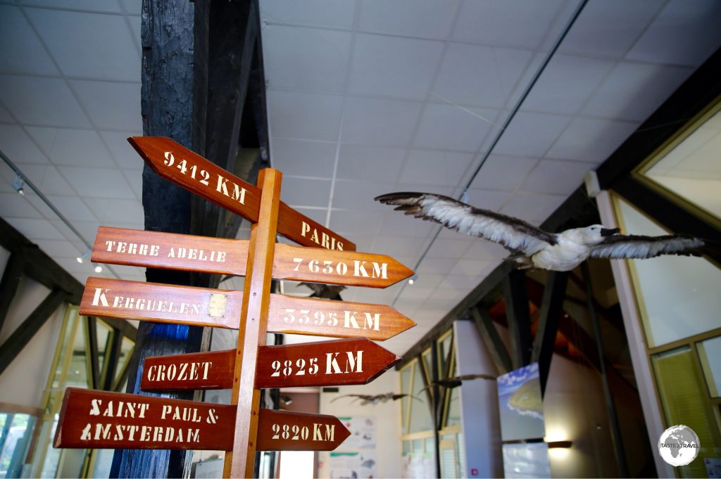 A marker inside the TAAF Information centre indicates distances to the various islands from St. Pierre.