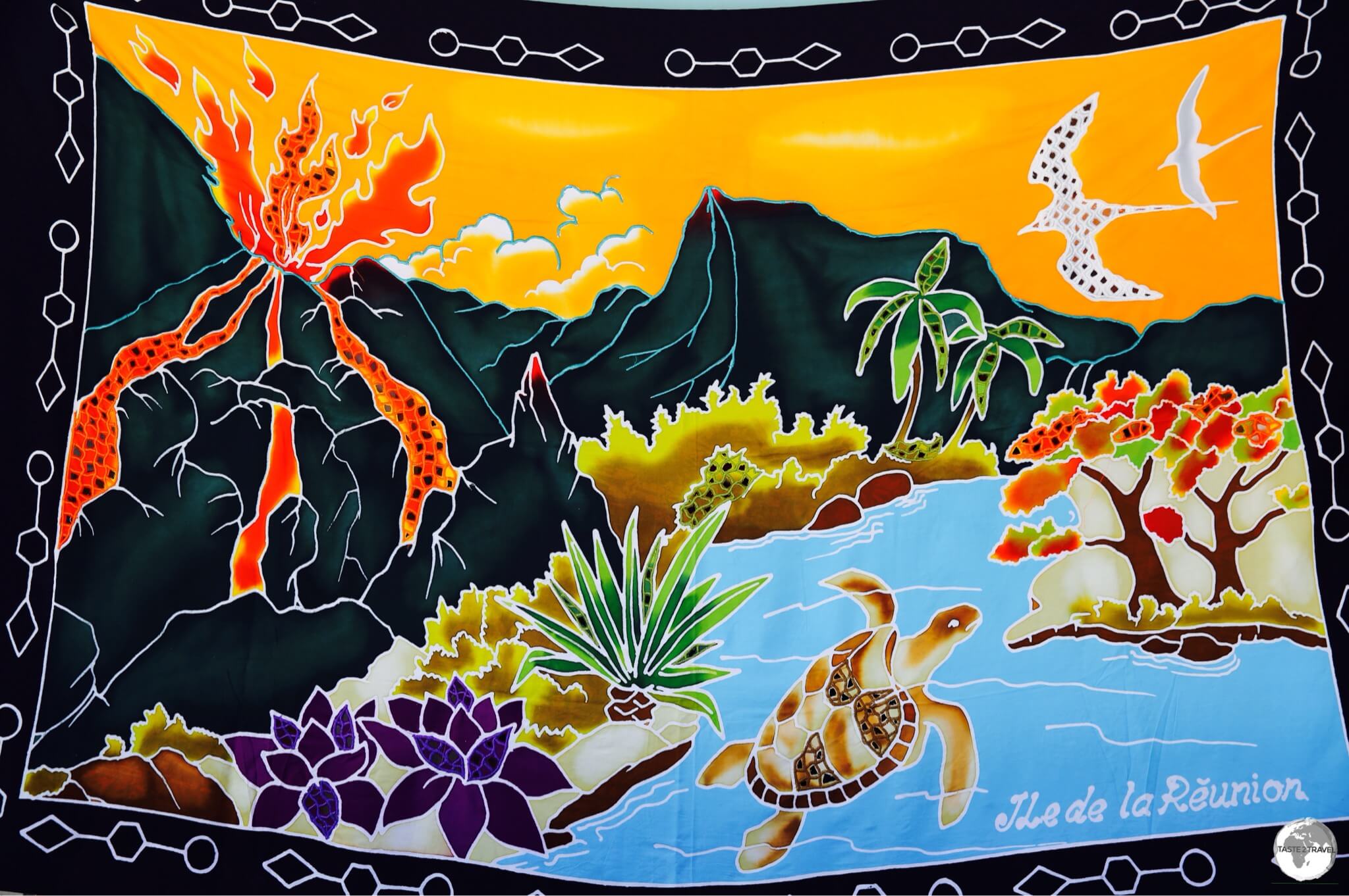 A hand-painted Reunion sarong features a fiery Piton de la Fournaise.