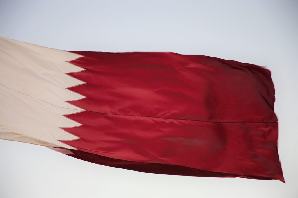 The flag of Qatar.