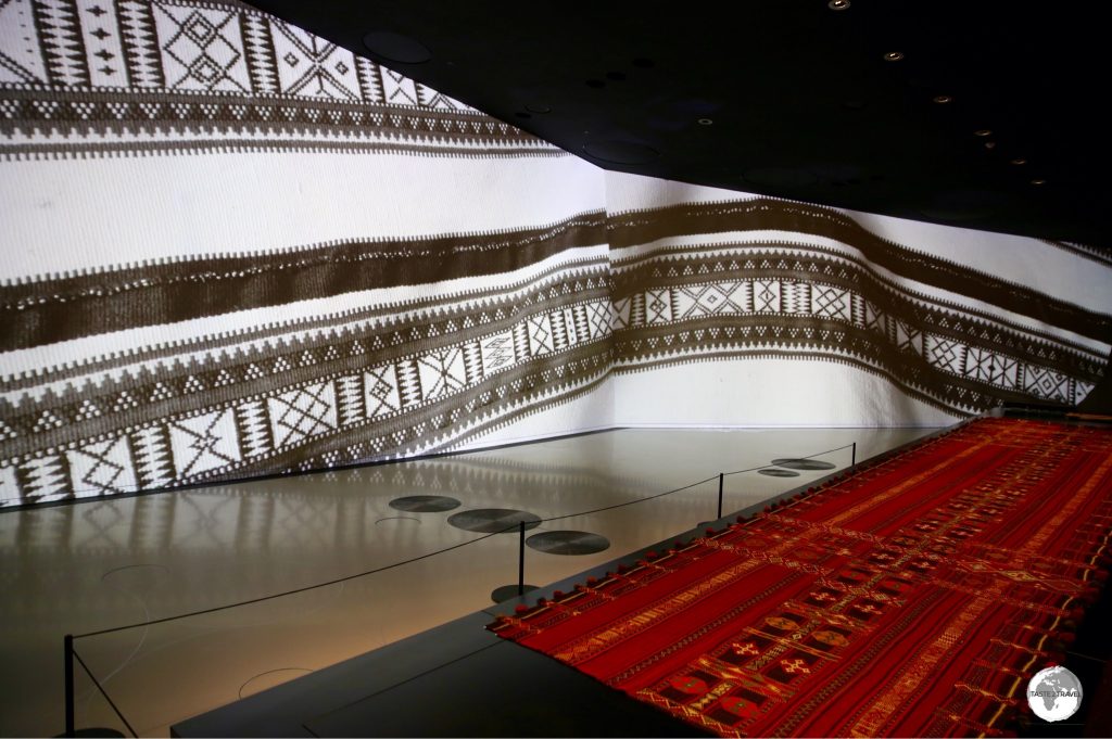 The large, curved walls of the galleries are used to project images which enhance the various displays.