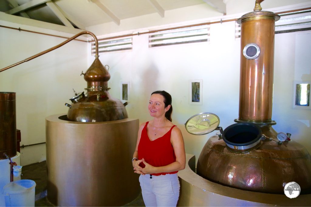 A friendly staff member at Takamaka rum conducting a tour.