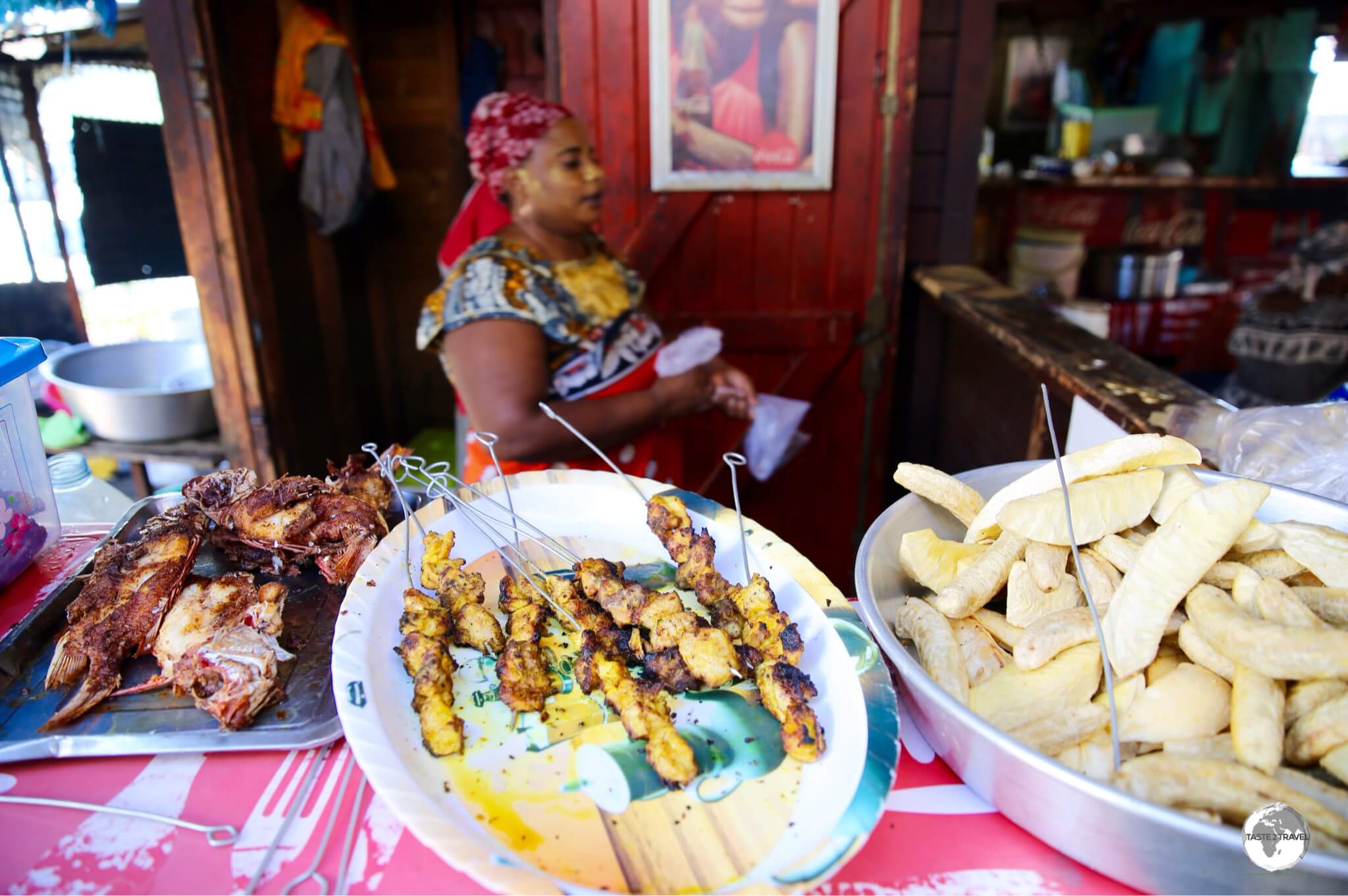 Food stalls at Mamoudzou central market offer affordable local food.