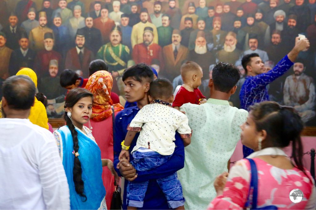 Bangladeshi visitor’s observing a mural of Bangladeshi leaders inside the Pink Palace museum.