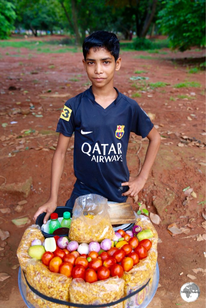 A young snack vendor in Suhrawardi Park.
