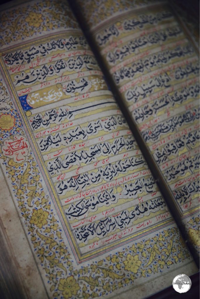 A sad sight - ancient hand-written, gold leaf, Islamic manuscripts rotting away in the humid heat.