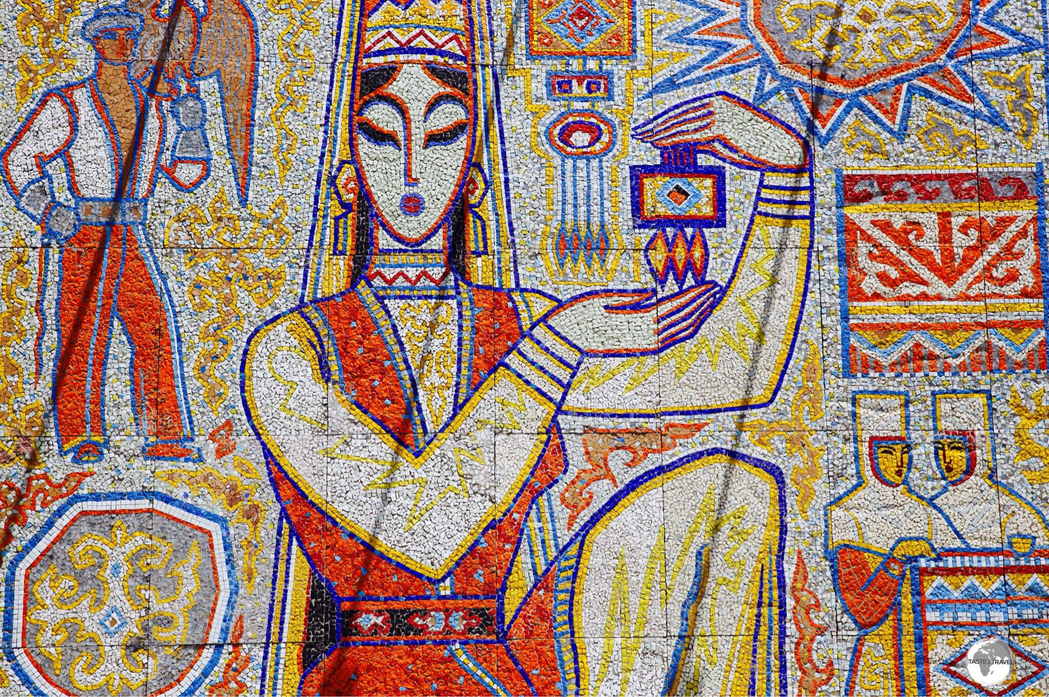 "The Girl with the Souvenir" is a tile mosaic which has been installed at Kok Tobe.