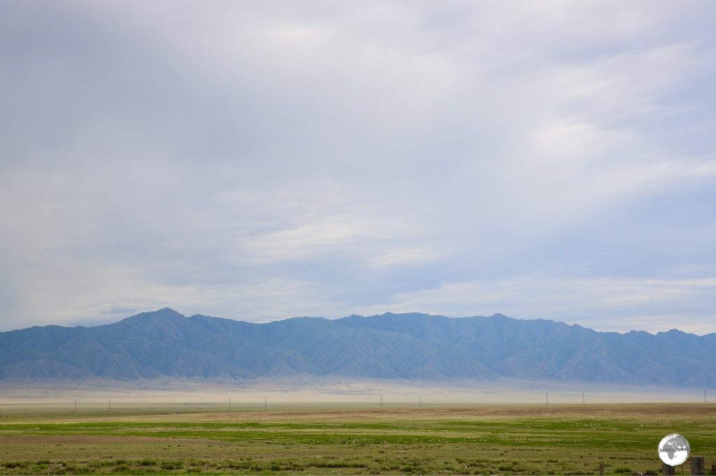 Wide open plains meet the towering Tien Shan mountains near Almaty,
