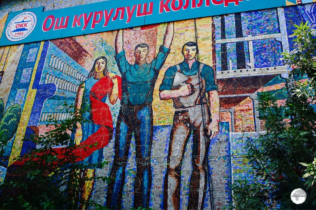 ‘Fabric’ is installed on the wall of a local technical college and shows three different workers, with one holding a length of red cloth, a symbol of communism.