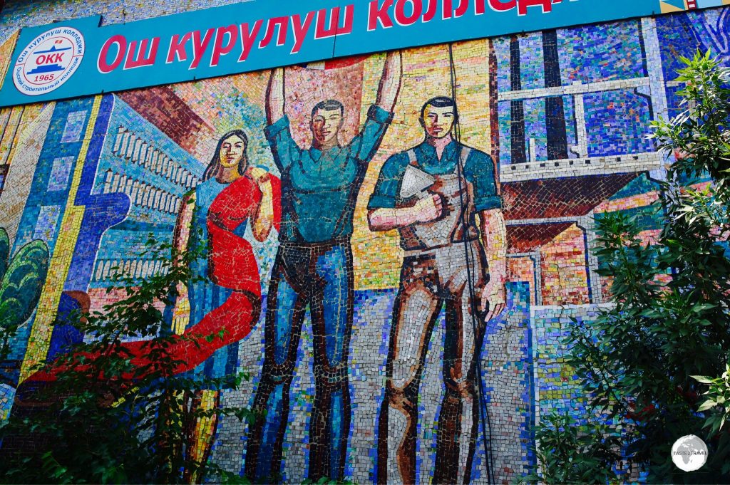 ‘Fabric’ is installed on the wall of a local technical college and shows three different workers, with one holding a length of red cloth, a symbol of communism.