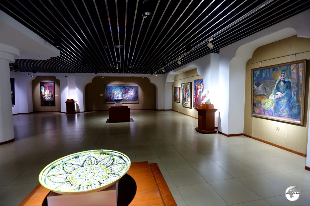 A display hall at the Tajikistan National Museum, featuring works by local artists.
