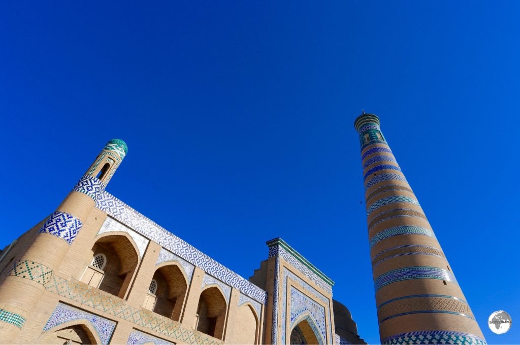 The Islam Khoja Minaret, the tallest in Uzbekistan, towers over the madrasah.