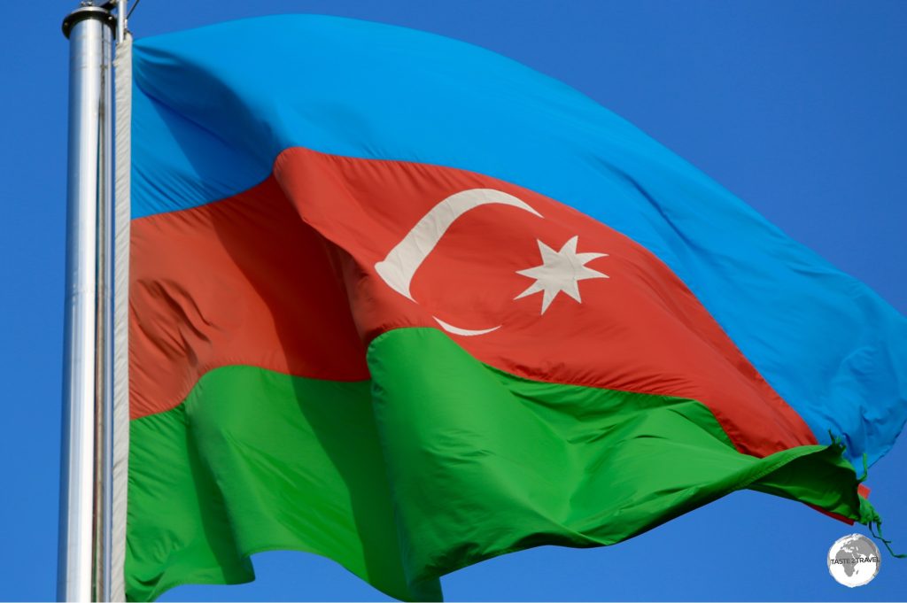 The flag of Azerbaijan flying on the waterfront in Baku.