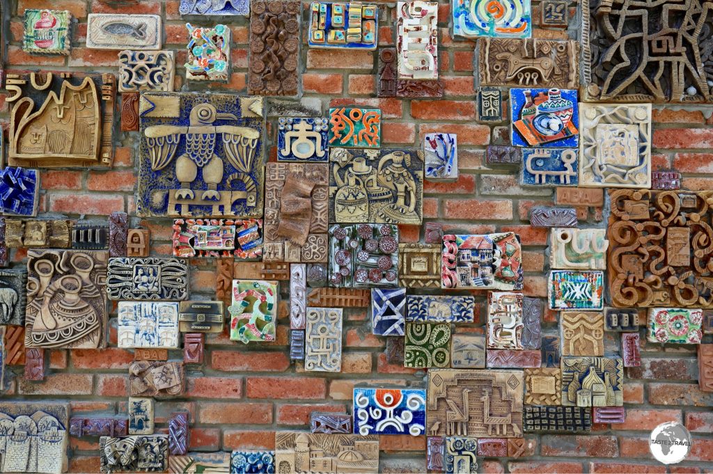 The wall of the arts and craft centre features locally made ceramic artwork.