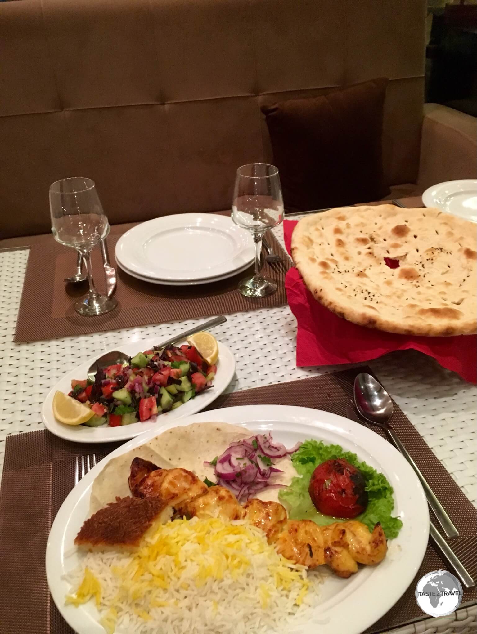 A typical meal in Azerbaijan - BBQ'd meat, salad, bread and some rice.