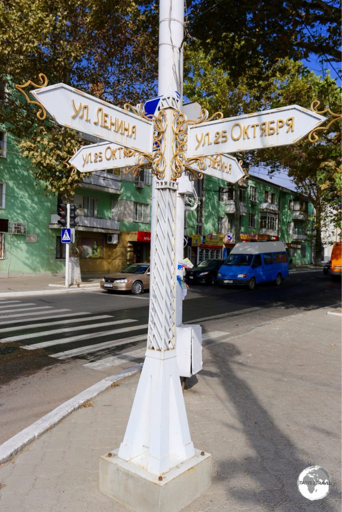 An ornate street sign in Tiraspol at the intersection of Lenin street and 25th of October street.