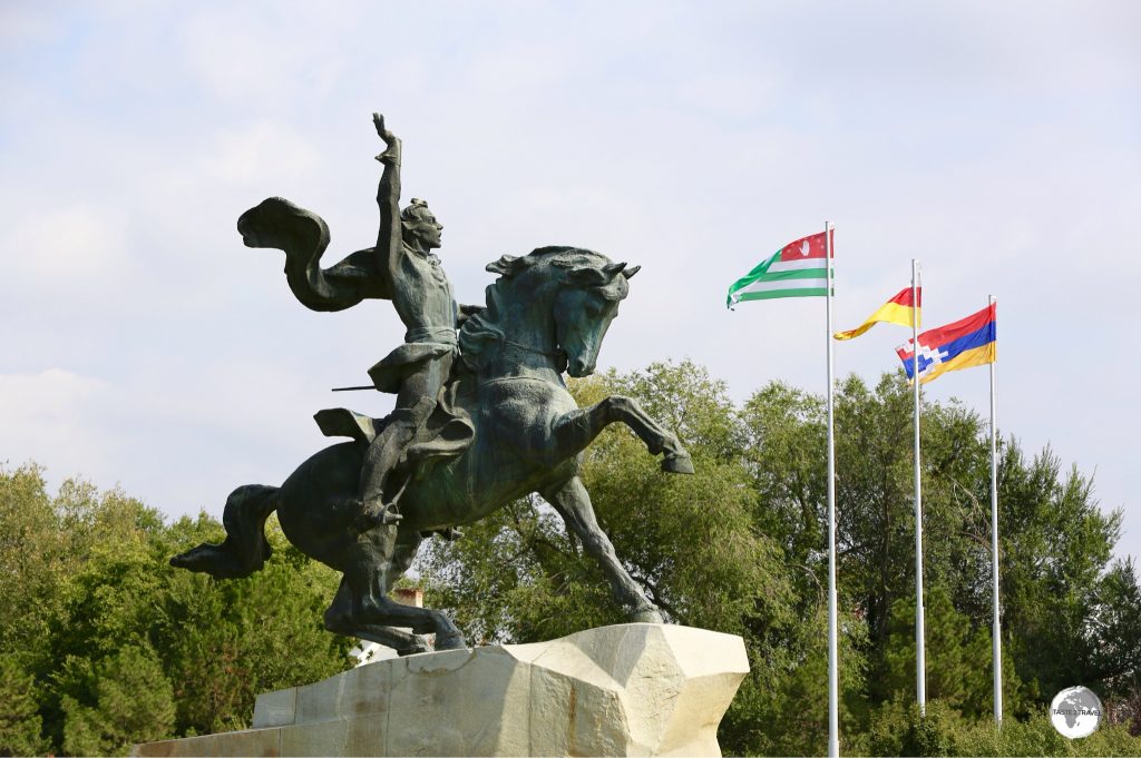 The monument to Suvorov in Tiraspol, with the flags of (l-r) Abkhazia, South Ossetia and the Republic of Artsakh.