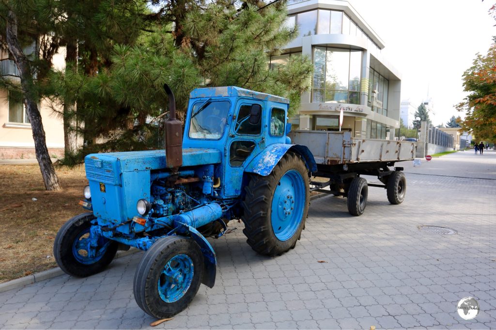 A Soviet-era tractor working on the main street of Tiraspol.