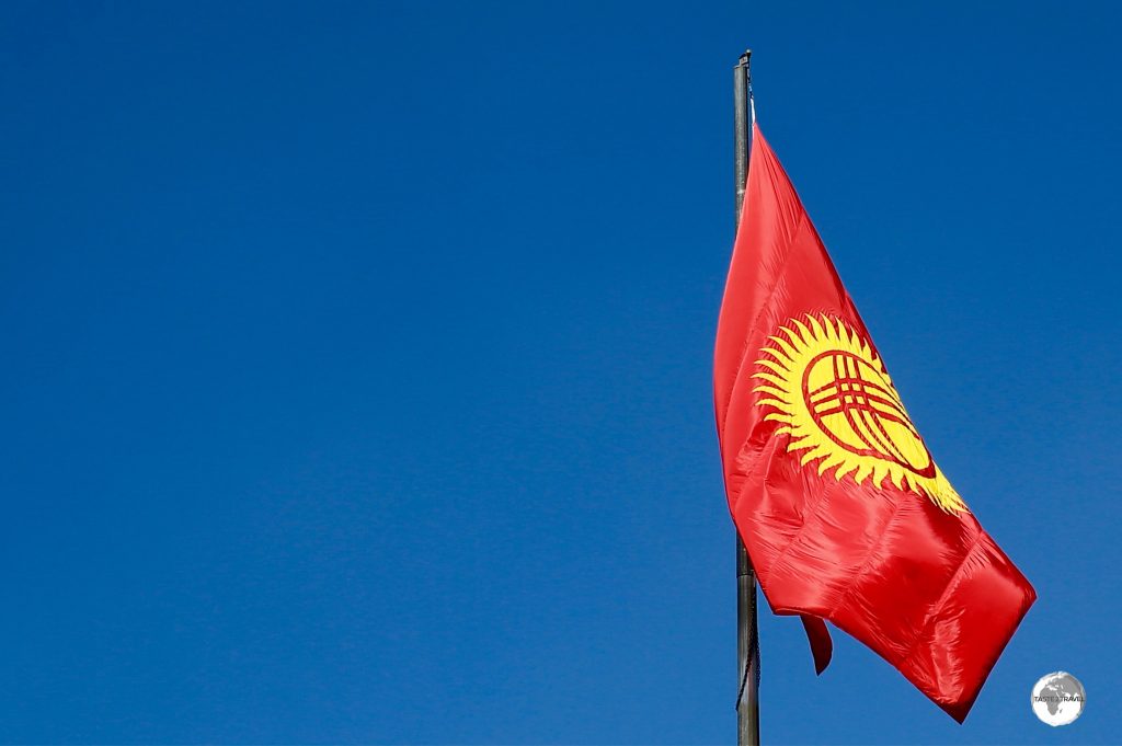 The flag of Kyrgyzstan which features a 'Tunduk' at its centre.