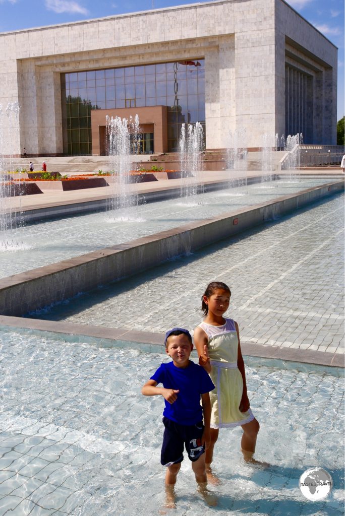 Children cooling off in one of many fountains which line Ala-Too square.