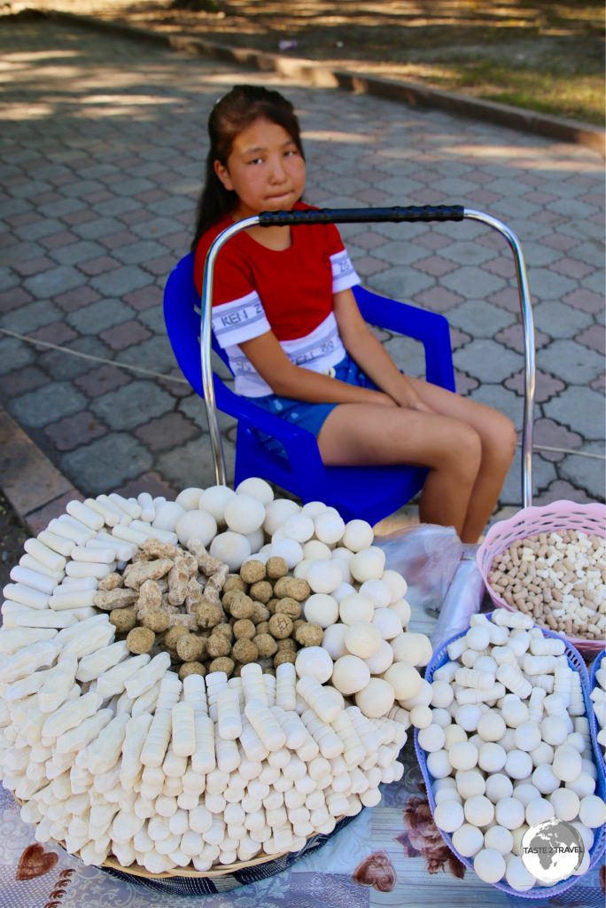 Selling Kashk or Qurt (a hard, salty fermented cheese snack) in Bishkek.