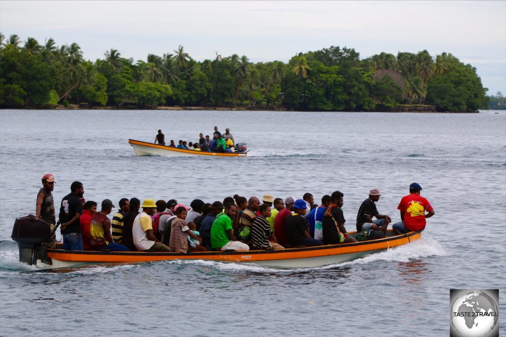 Banana boats transporting villagers to and from Madang.