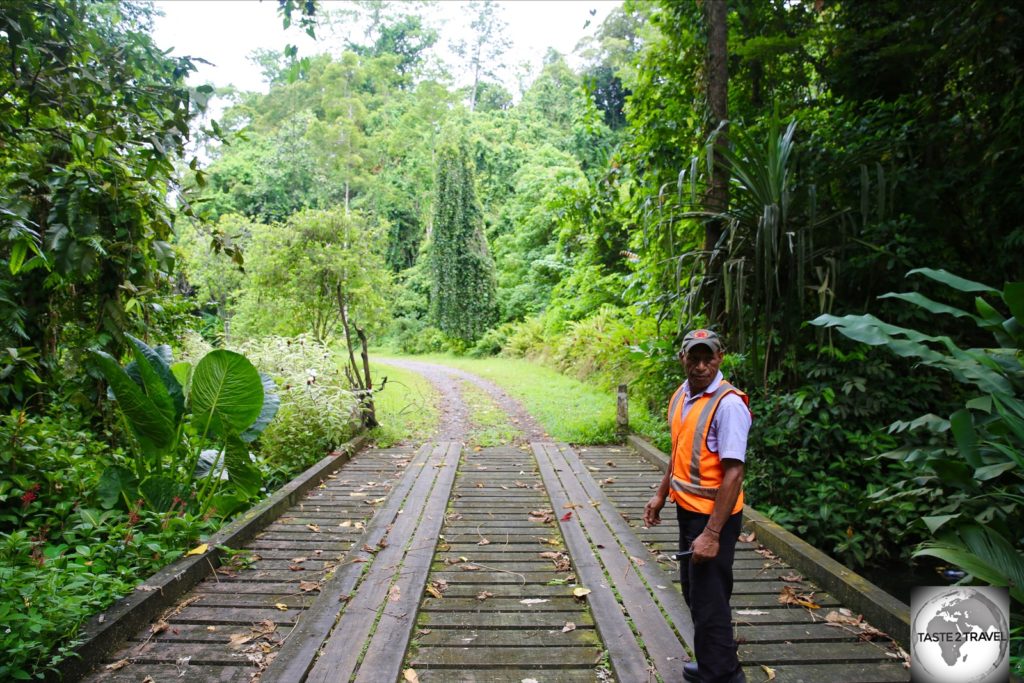 The friendly security guard at Lae Botanical Garden. I was not allowed to proceed beyond this bridge.