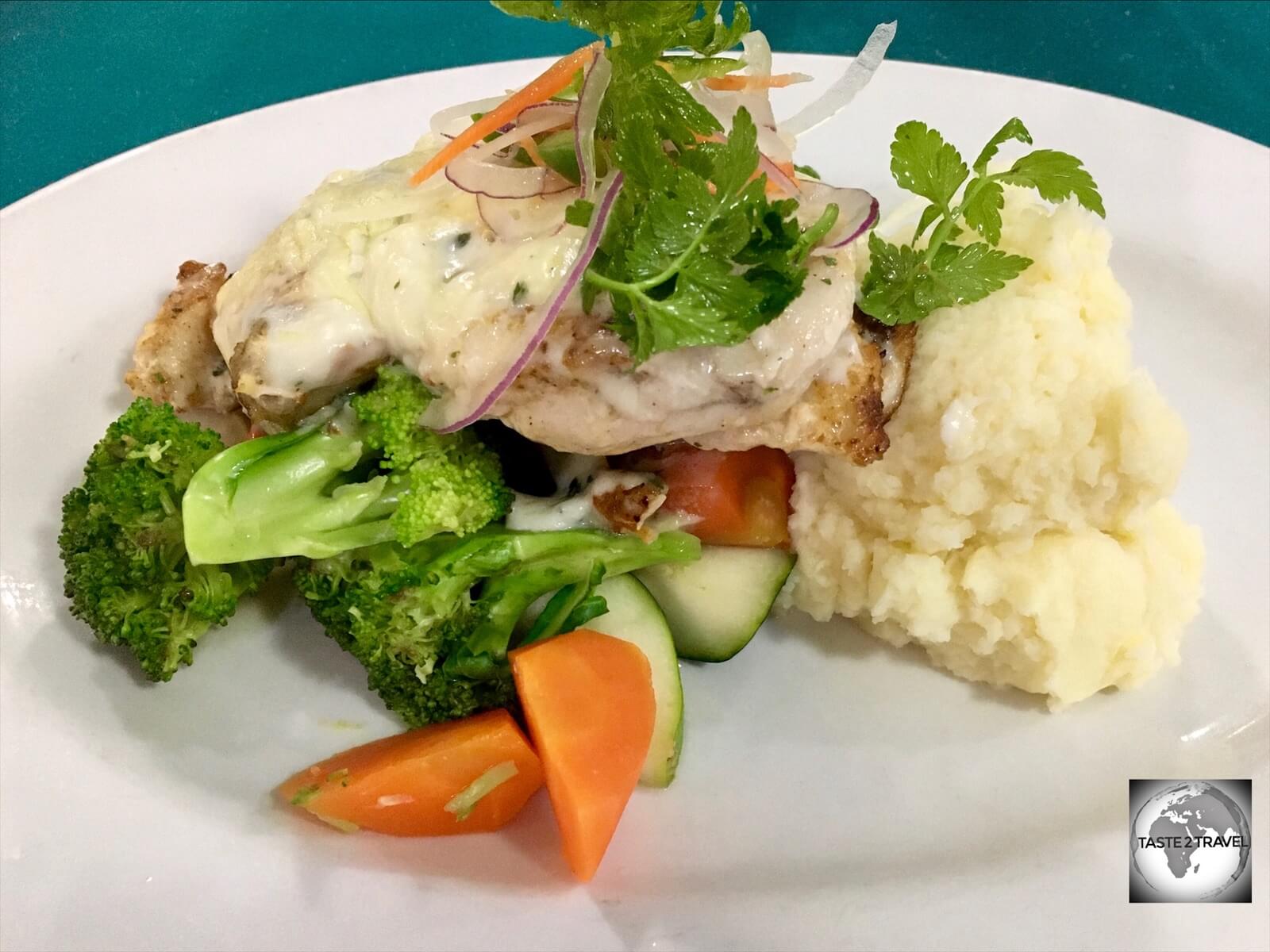 A favourite dish at the Madang resort - grilled local fish with Mornay sauce and vegetables.