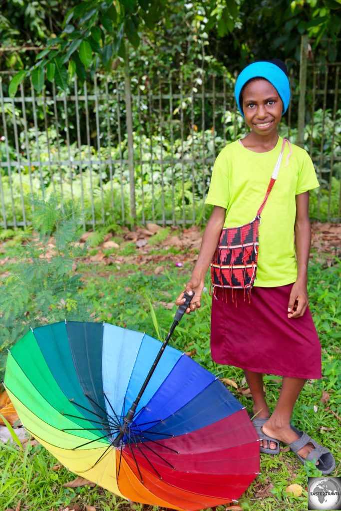 A young girl in Lae posing for the camera.