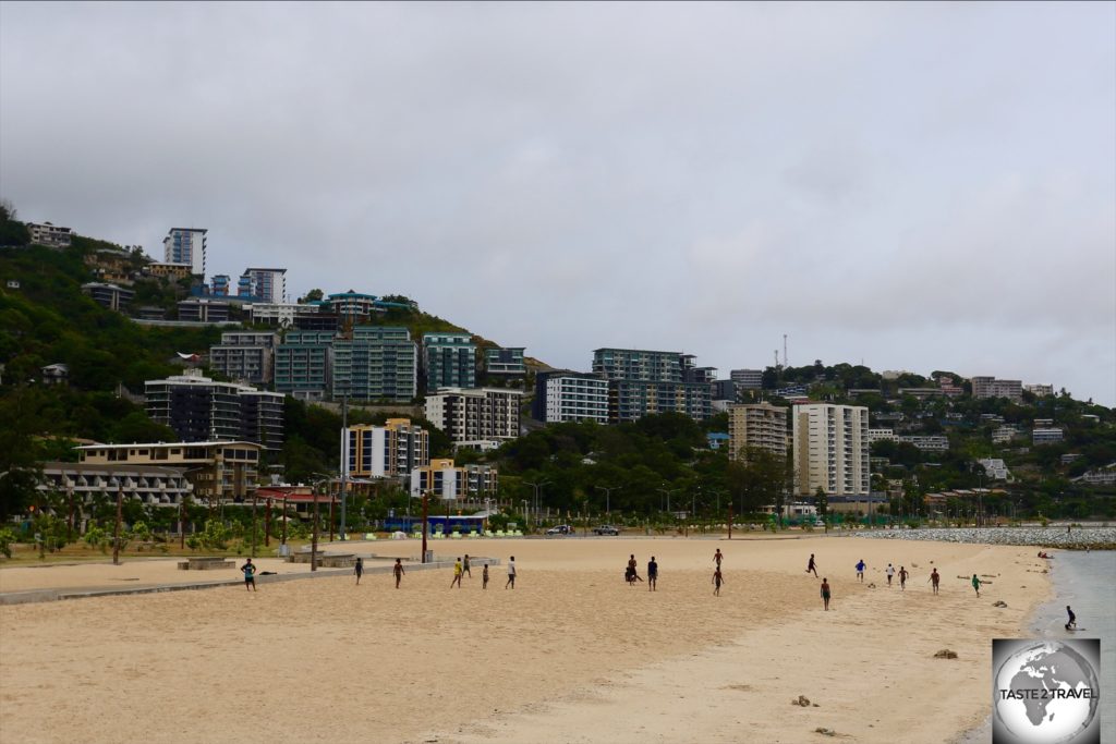 The golden sands of Ela beach are a popular recreation area, where local boys love to play rugby.