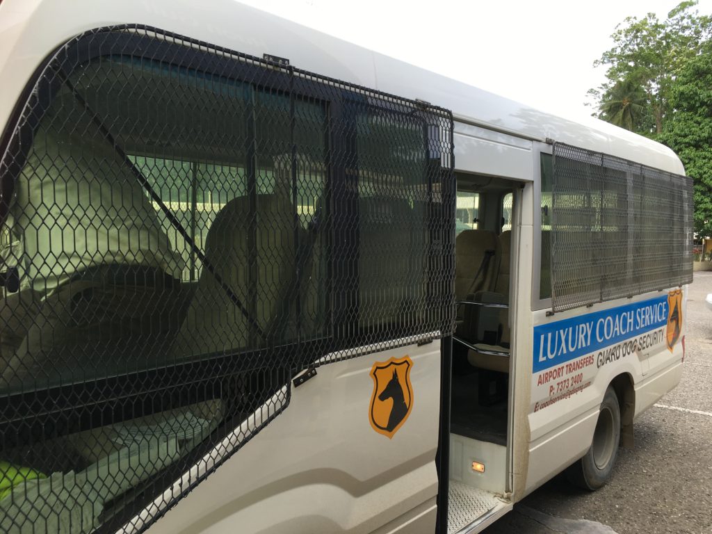 The Guard Dog Security company airport shuttle bus in Lae.