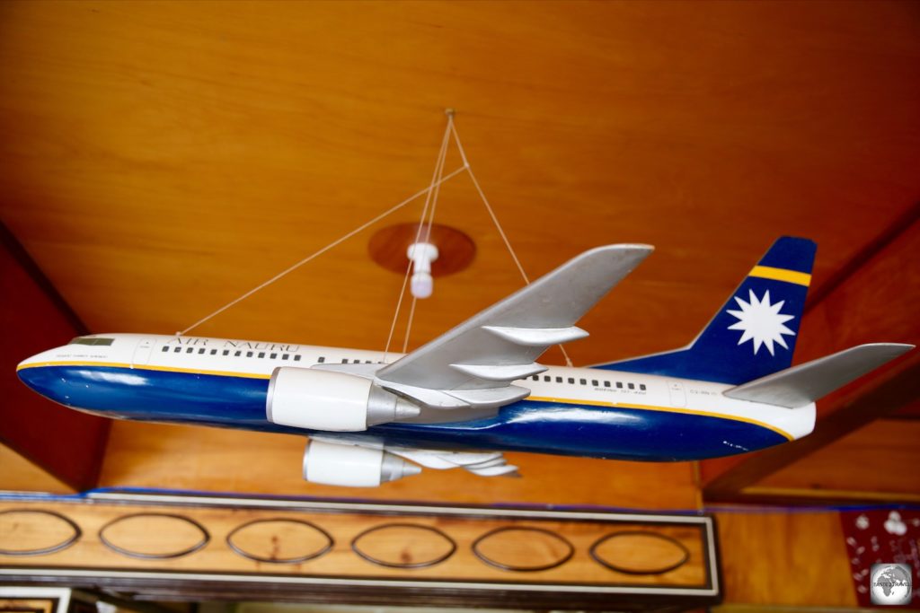 A model of an old Air Nauru plane hangs from the ceiling of the reception at the OD-N-Aiwo Hotel.