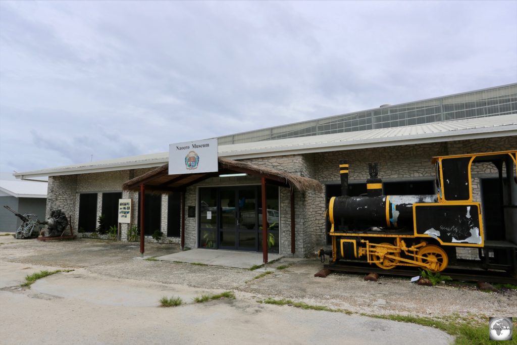 A view of the Naoero Museum with one of the locomotives from the old phosphate railway on the right. The railway was built by the Pacific Phosphate Company in 1907.