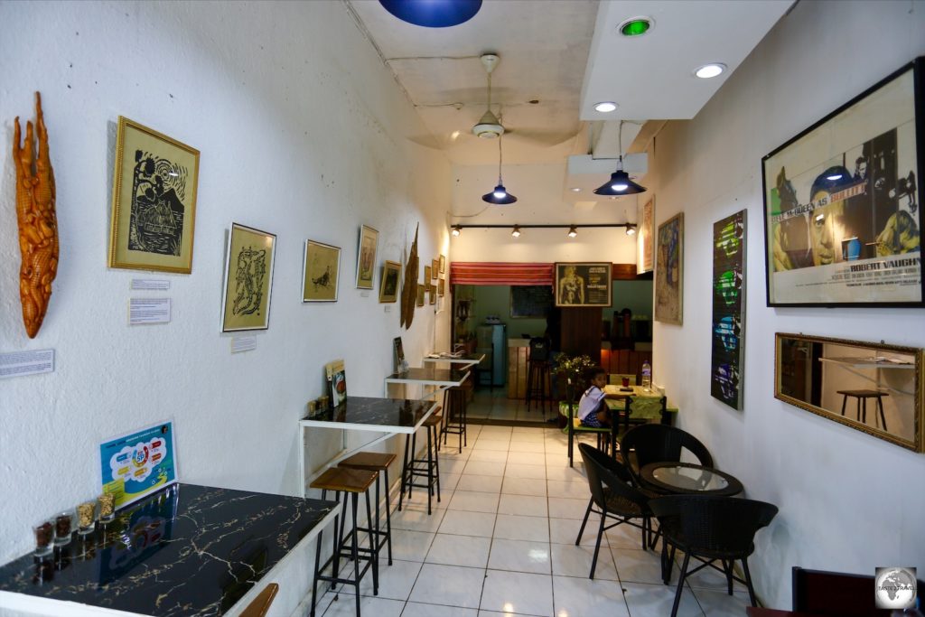 An interior view of Fatima Café, whose walls serve as an art gallery, with works by local artists available for purchase.