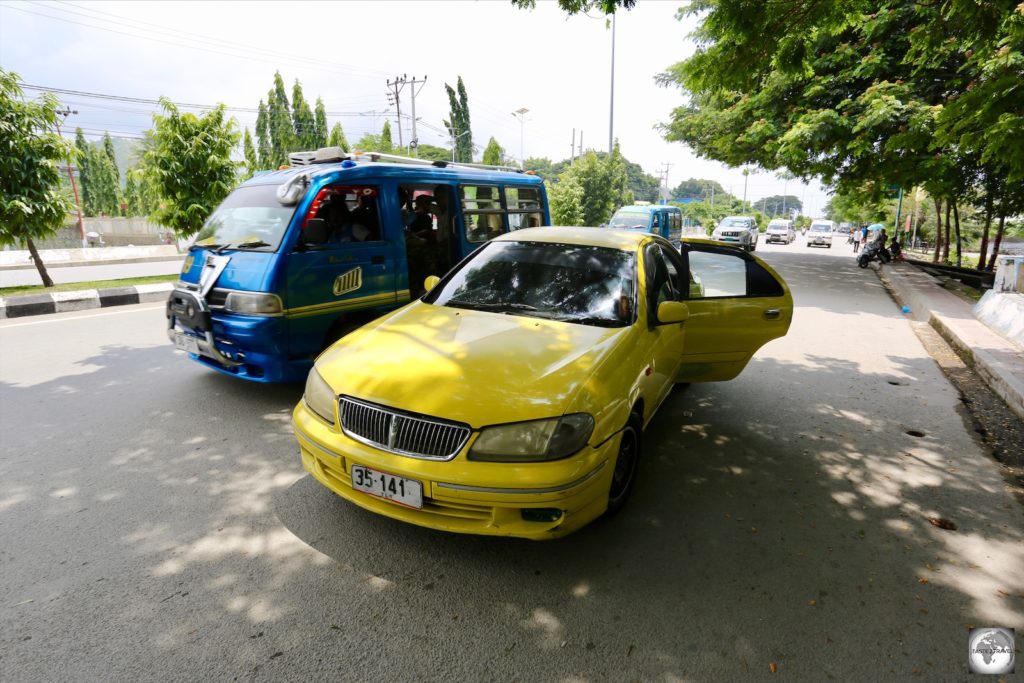A taxi and mikrolet, the main forms of transport in Dili.