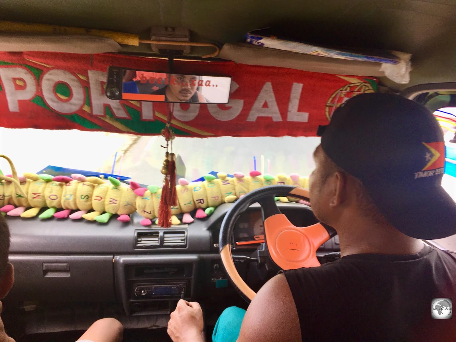 Interior view of a Mikrolet, which includes a tribute to the former colonial motherland.