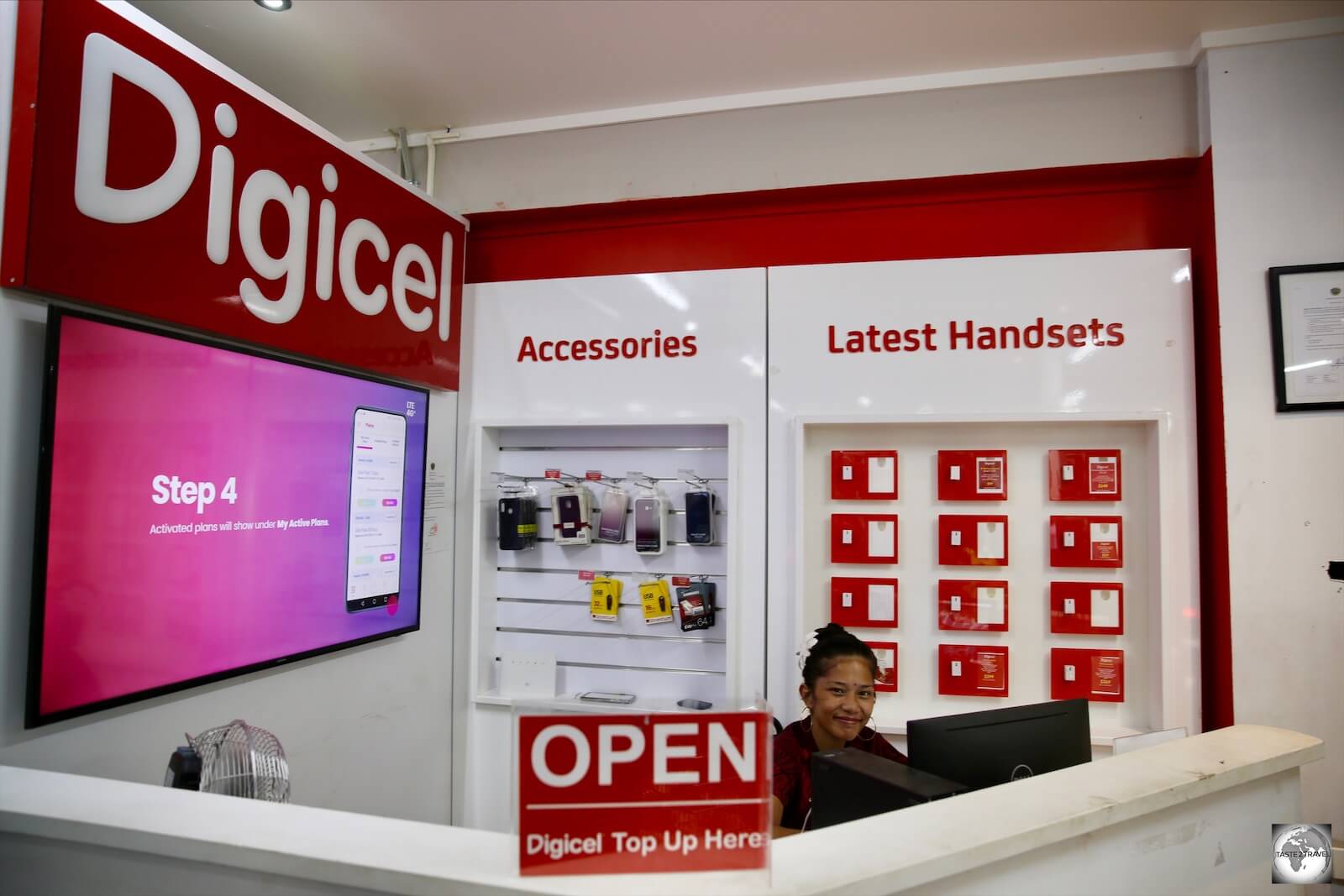 A friendly Digicel staff member at the Digicel kiosk at Capelle and Partners.