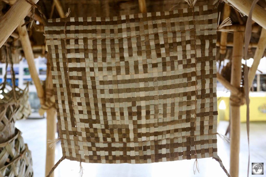 A close-up view of a traditional ‘Tribal Mat’. About the size of a place-mat, these were worn around the waist by woman with the distinct pattern indicating their tribe.