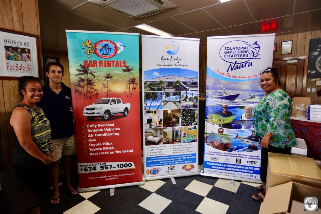 The wonderful staff at Capelle and Partners showing off their new banner ads which feature their car rental, accommodation and fishing charter businesses.