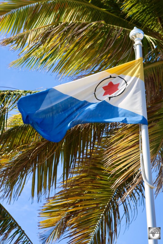 The flag of Bonaire, flying in downtown Kralendijk.