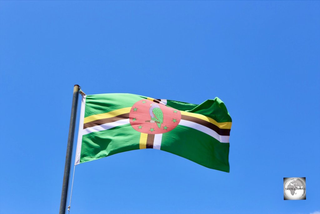 The flag of Dominica flying in Roseau.