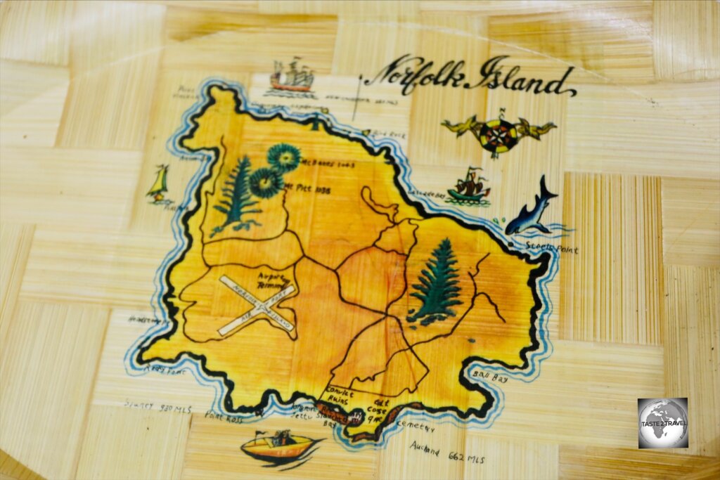 A map of Norfolk Island adorns a souvenir plate.
