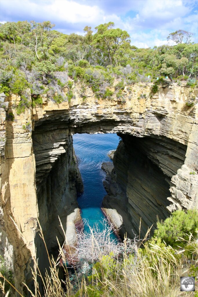 Located on the Tasman peninsula, Tasman's Arch is a 53-metre tall natural bridge, carved out by the Tasman sea.