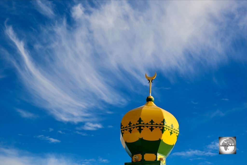 The green and gold minaret of the Home Island mosque.
