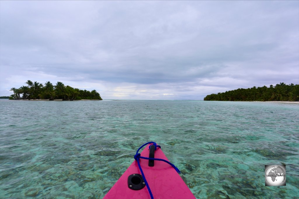 Cruising around the southern islands of the atoll in my motorised canoe.