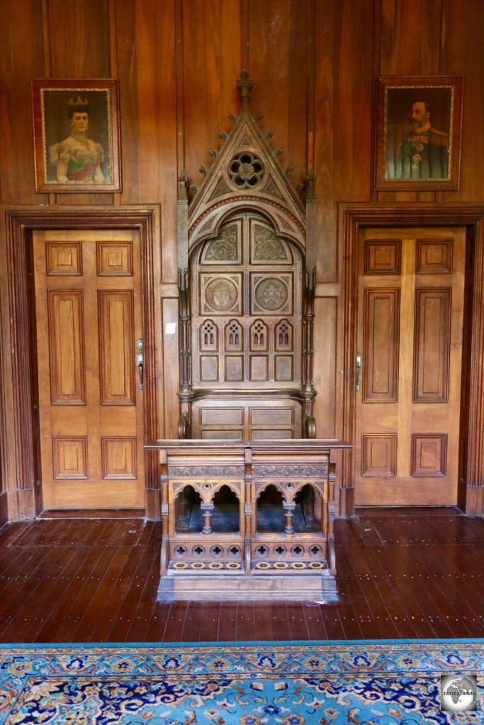 The vestibule of Oceania house features an antique bishop's chair.